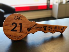 Zac' laser engraved rimu 21st key.