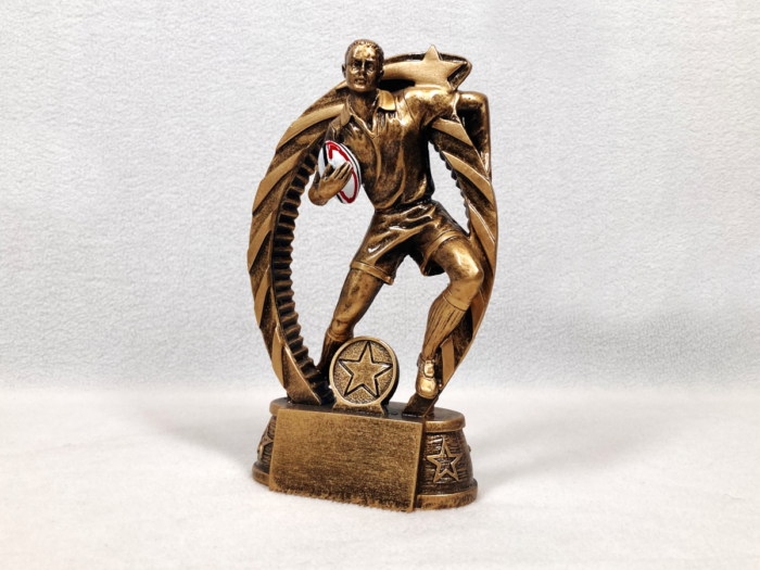 Male Rugby Player with Ball Trophy
