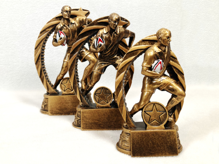 Male Rugby Player with Ball Trophy