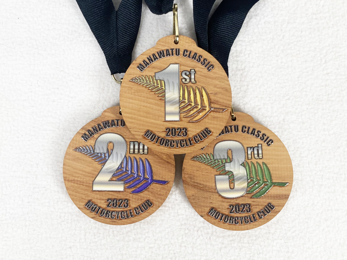 Photo of medals made from recycled rimu